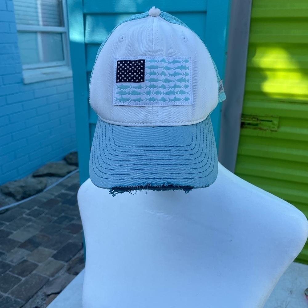 Blue and White Trucker Hat with Fish Flag Patch distressed look.